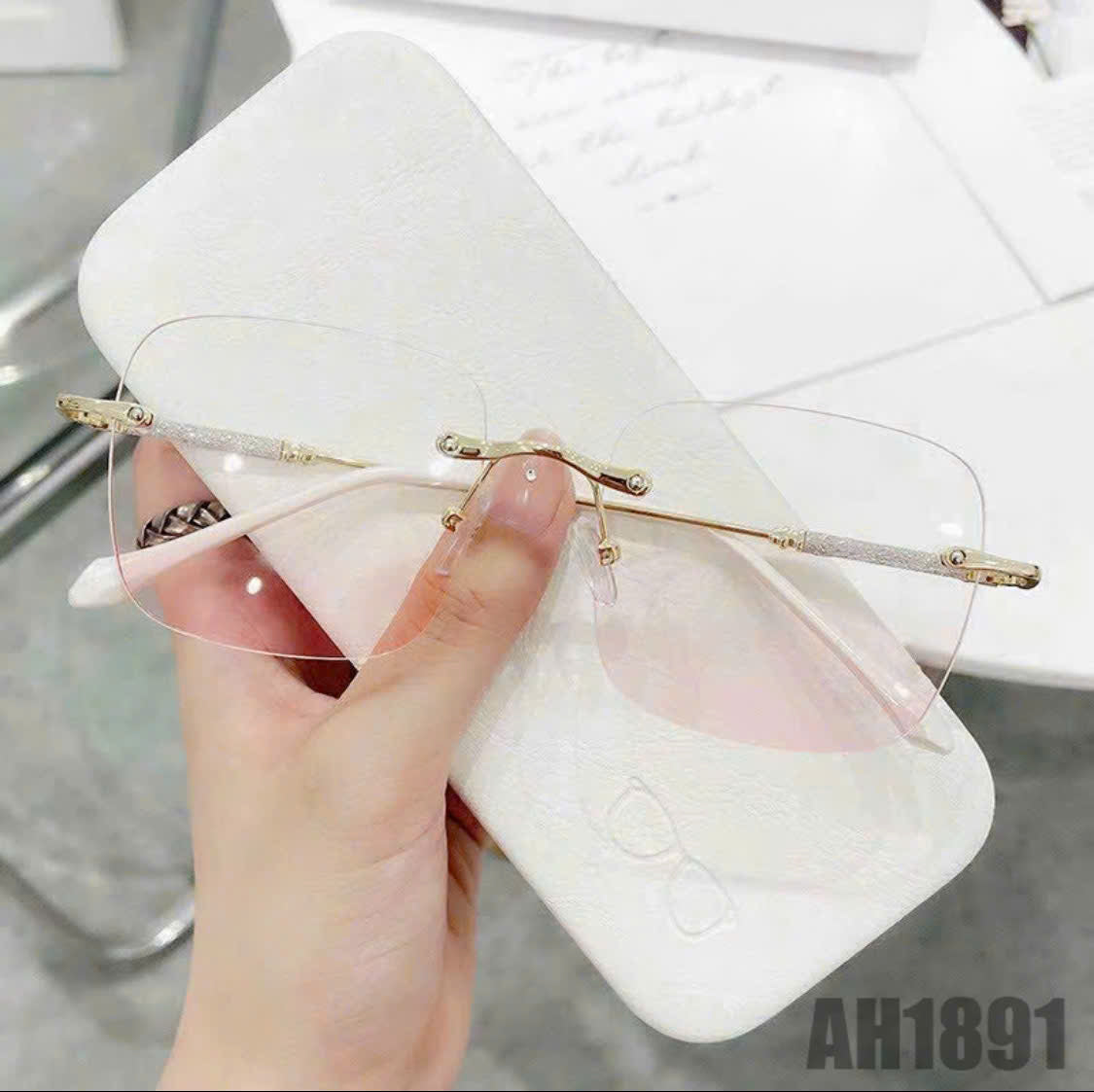 Rimless blush-colored sunglasses, model THNT017