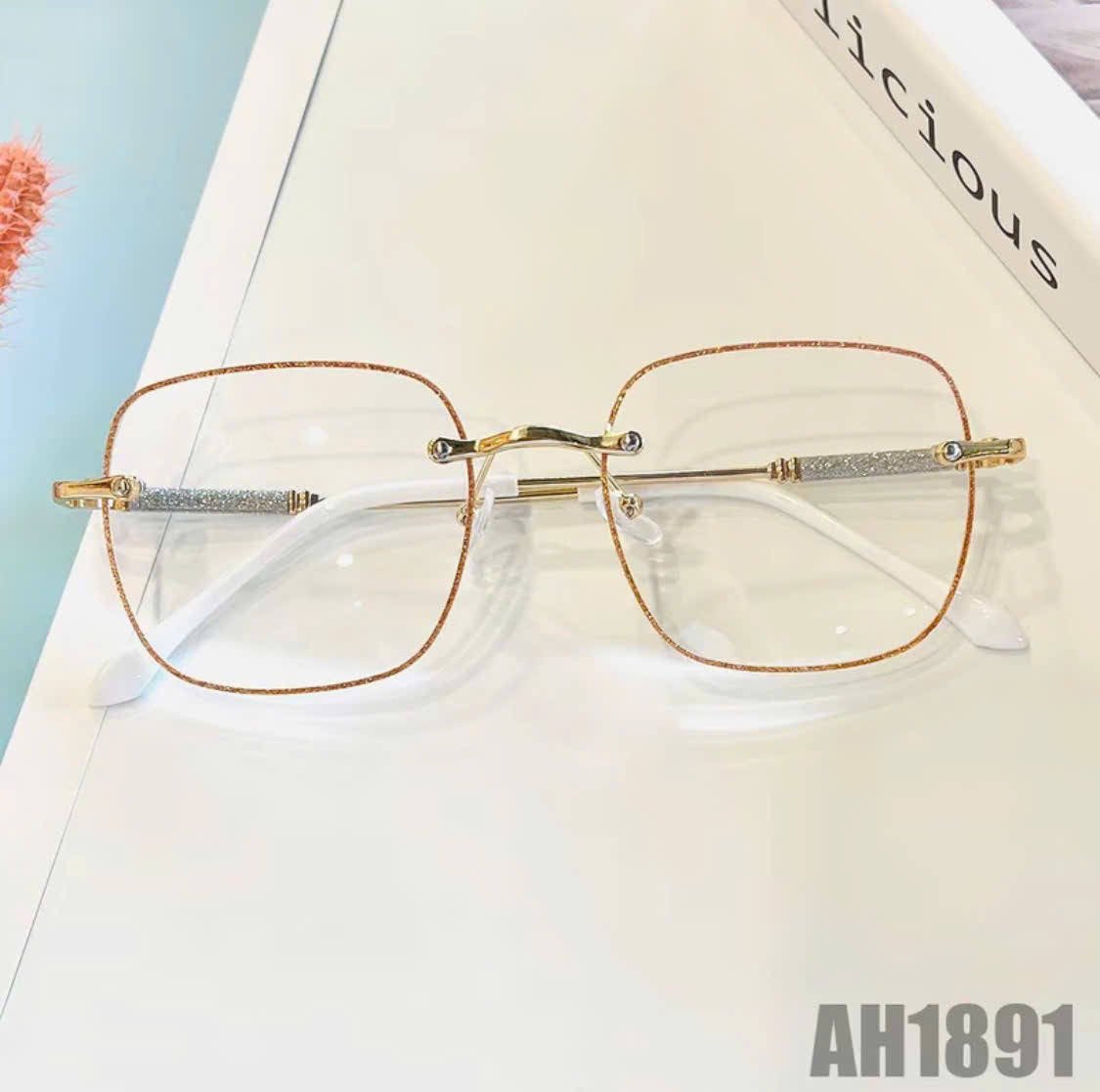Rimless blush-colored sunglasses, model THNT017