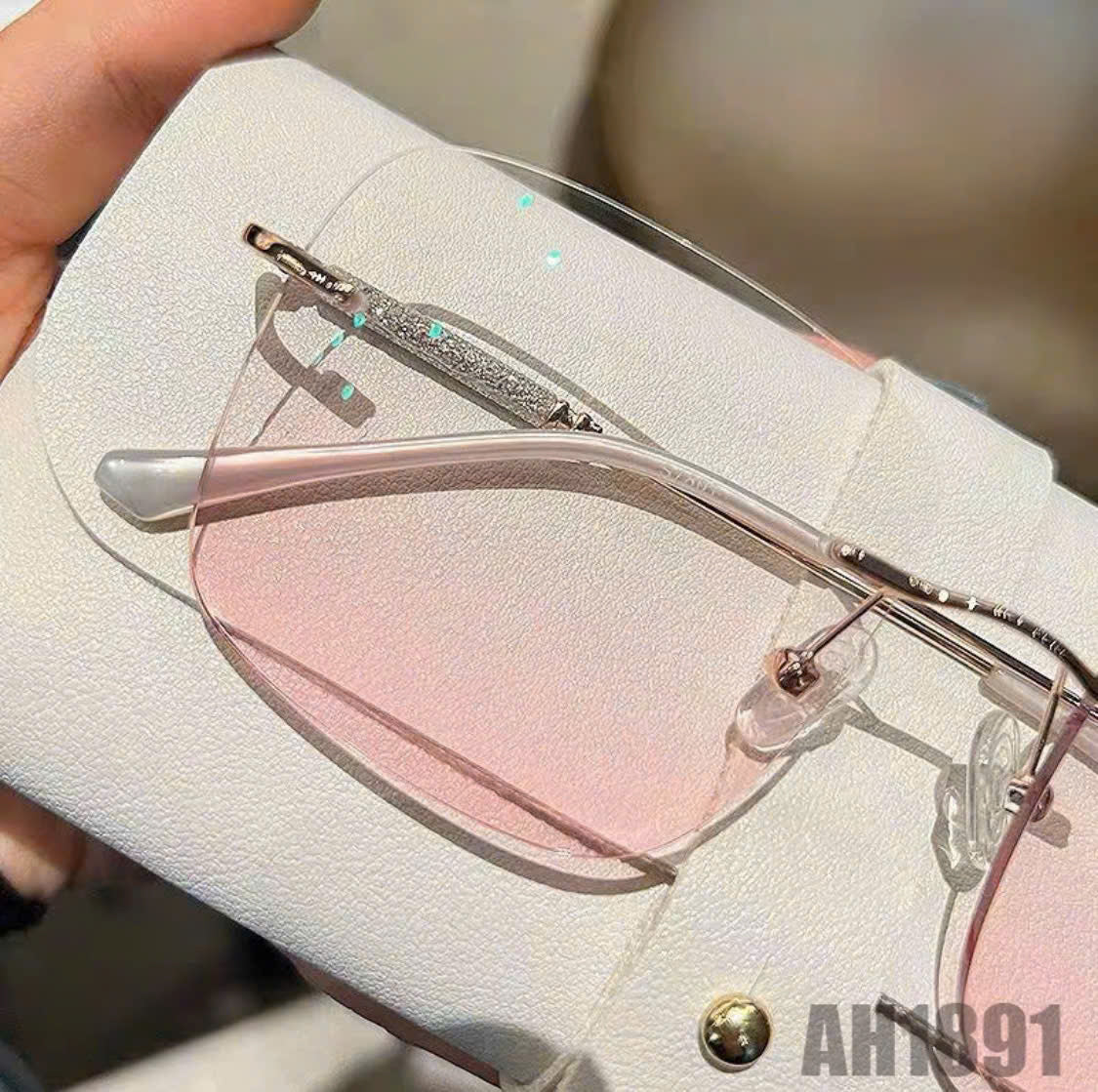 Rimless blush-colored sunglasses, model THNT017